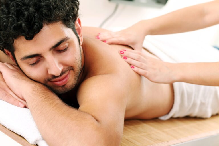 Young and handsome guy enjoying massage therapy