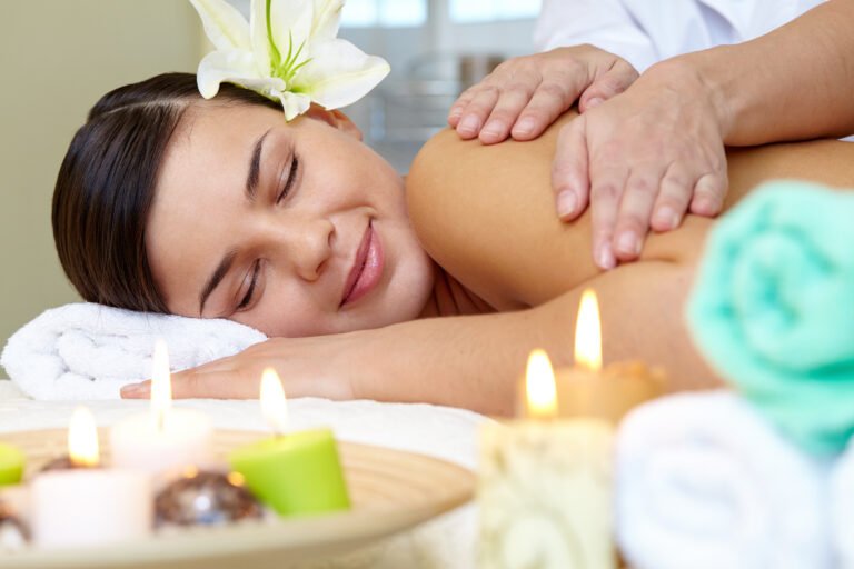 Portrait of young female enjoying the procedure of massage